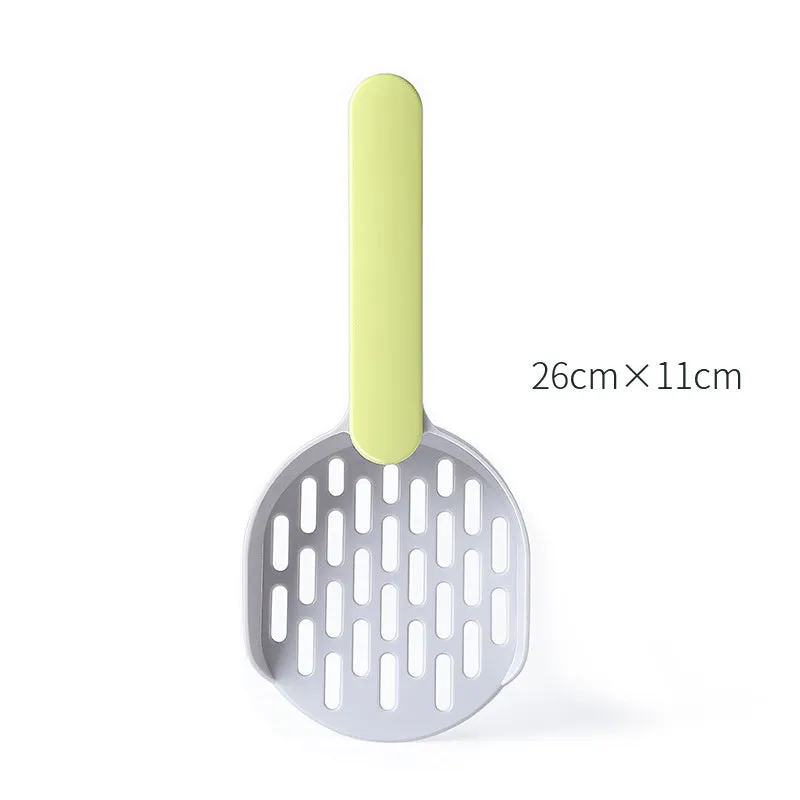 Blue plastic cat litter shovel scoop for cleaning litter boxes, shown next to a litter tray.