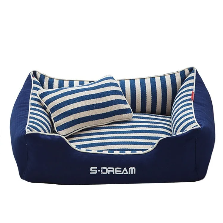 Navy stripes removable dog kennel mat and matching mini pillow set on a wooden floor