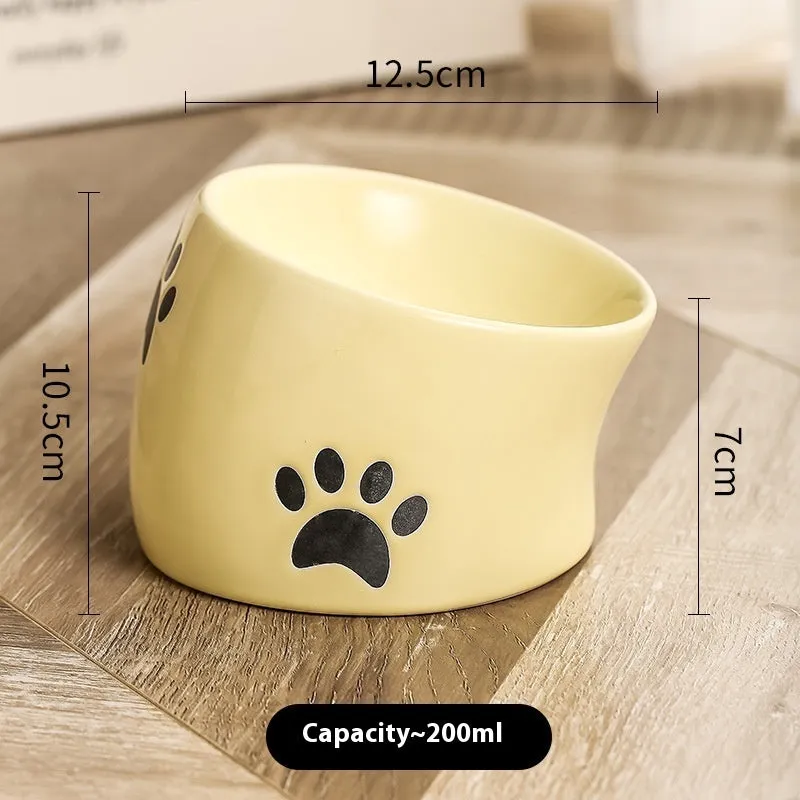Ceramic cat bowl with high-foot design and cat's paw pattern in choice of colours