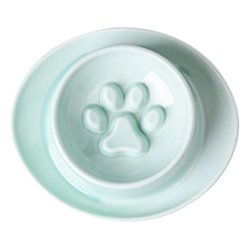 Green ceramic pet bowl with raised neck protection collar and anti-knock slow feed design