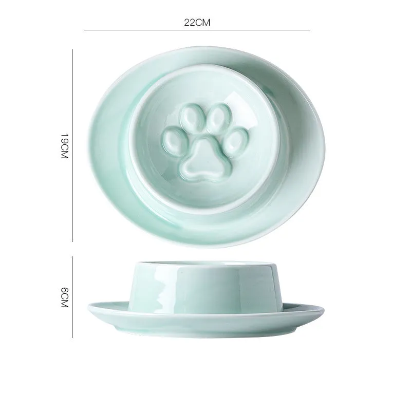 Green ceramic pet bowl with raised neck protection collar and anti-knock slow feed design