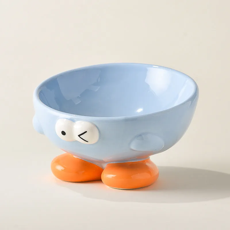 Oblique ceramic pet bowl with cute expression pattern, tall design for cervical spine protection