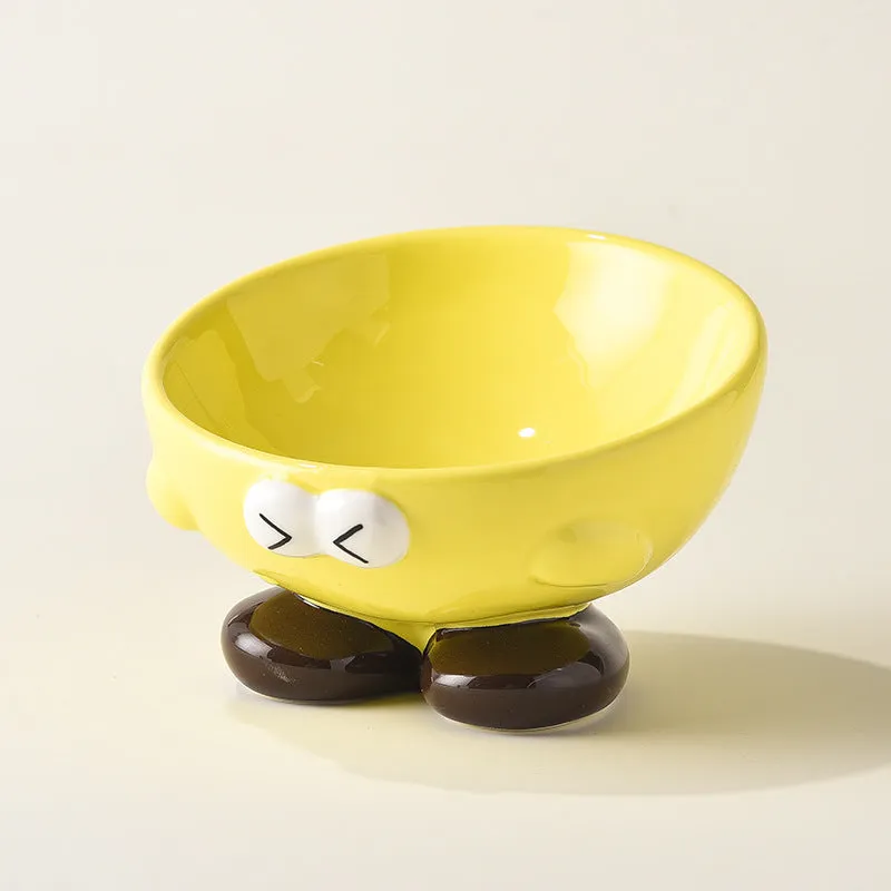 Oblique ceramic pet bowl with cute expression pattern, tall design for cervical spine protection