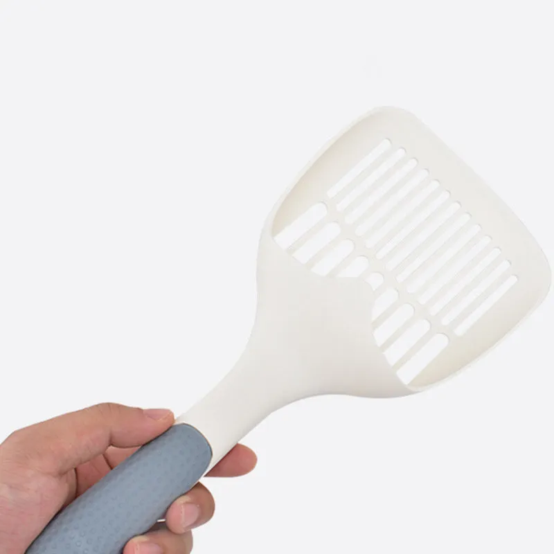 Large white plastic cat litter shovel with slotted drainage holes on a 22cm wide scoop