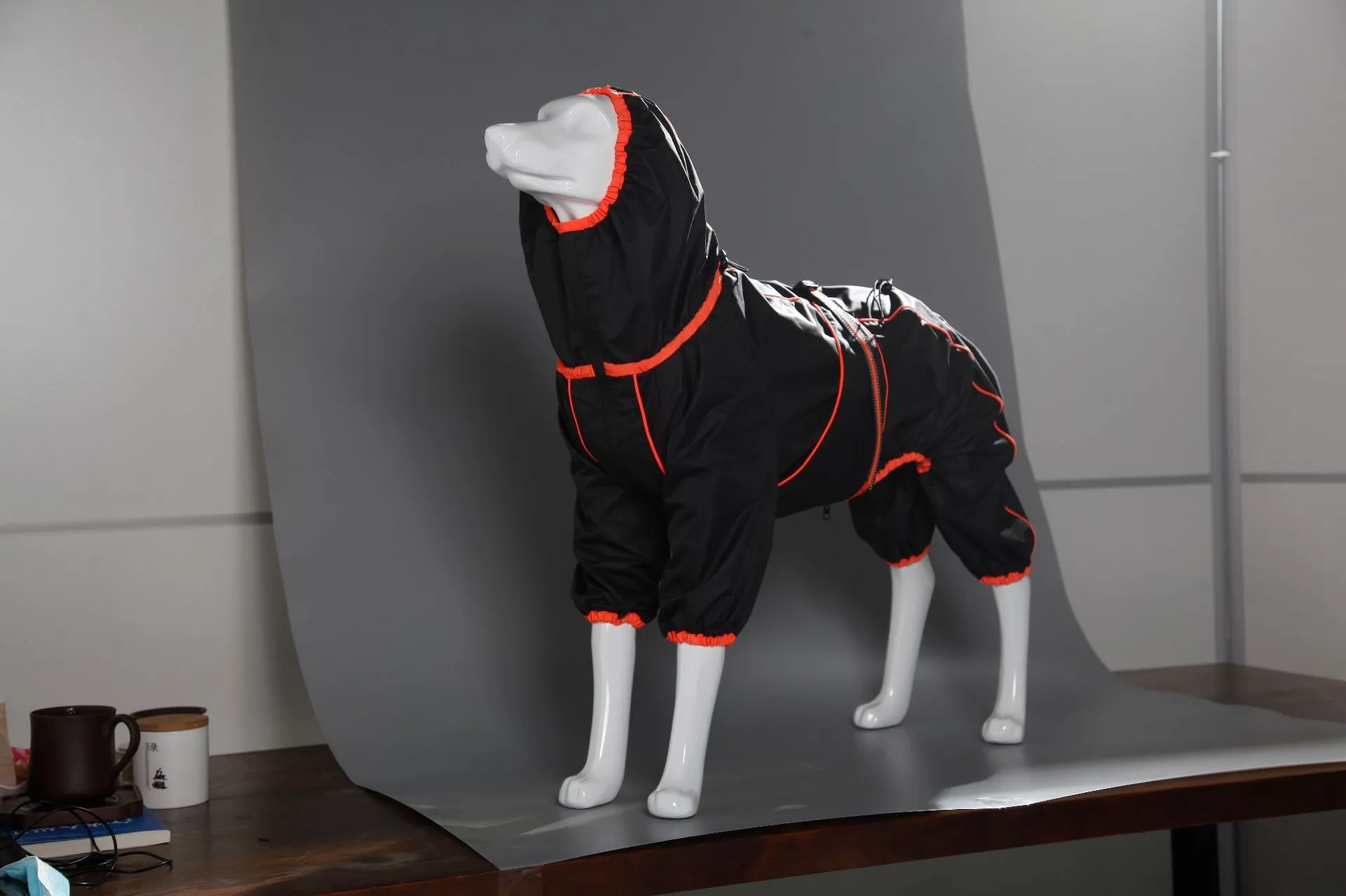 Red dog shell jacket with cotton padding, shown on a model dog.
