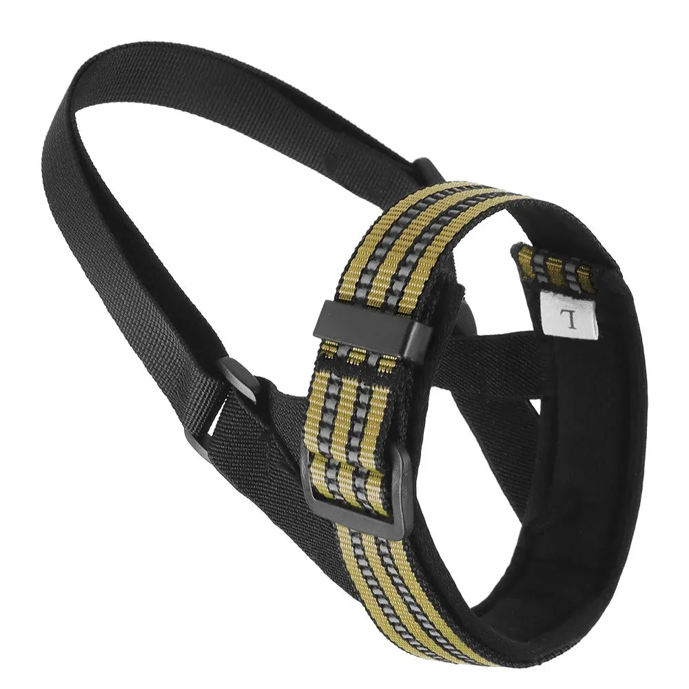 Adjustable black mesh dog muzzle with reflective strips and padded nose guard on a dog