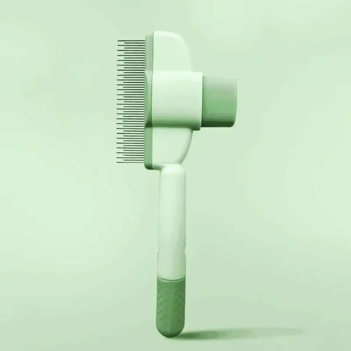 Green and yellow handheld dog grooming brush with one-click hair removal function.