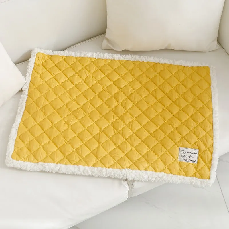 Soft blue terry cloth pet blanket for cats, shown on a pet bed, with size and colour options displayed.