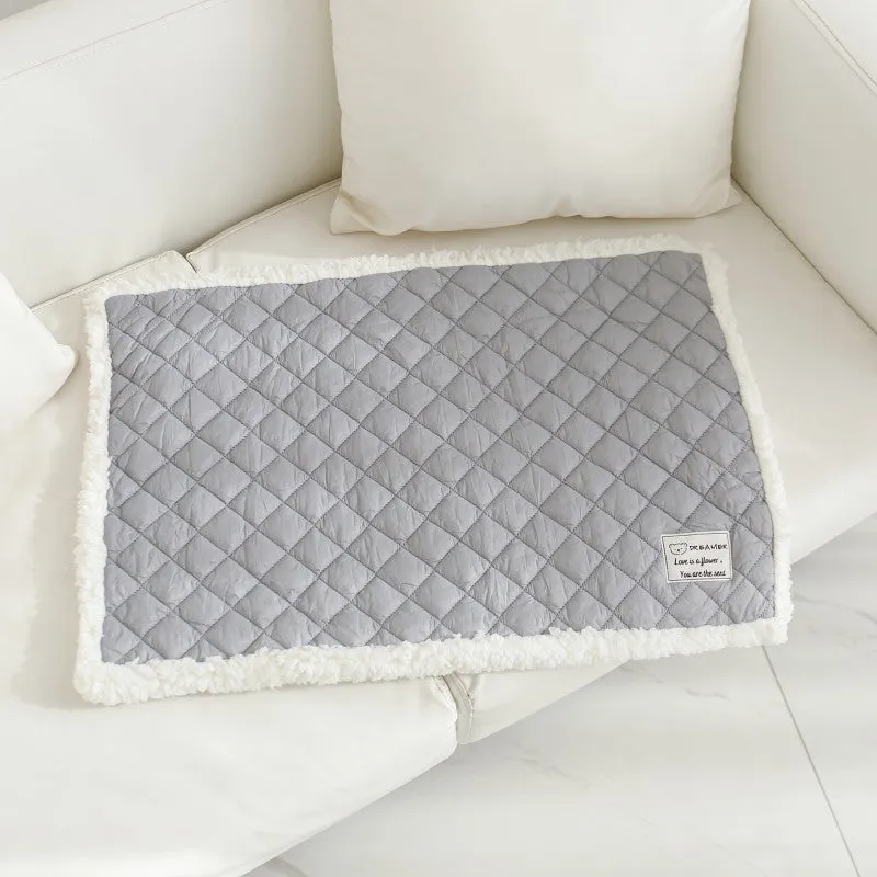 Soft blue terry cloth pet blanket for cats, shown on a pet bed, with size and colour options displayed.