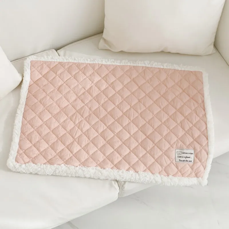 Soft blue terry cloth pet blanket for cats, shown on a pet bed, with size and colour options displayed.