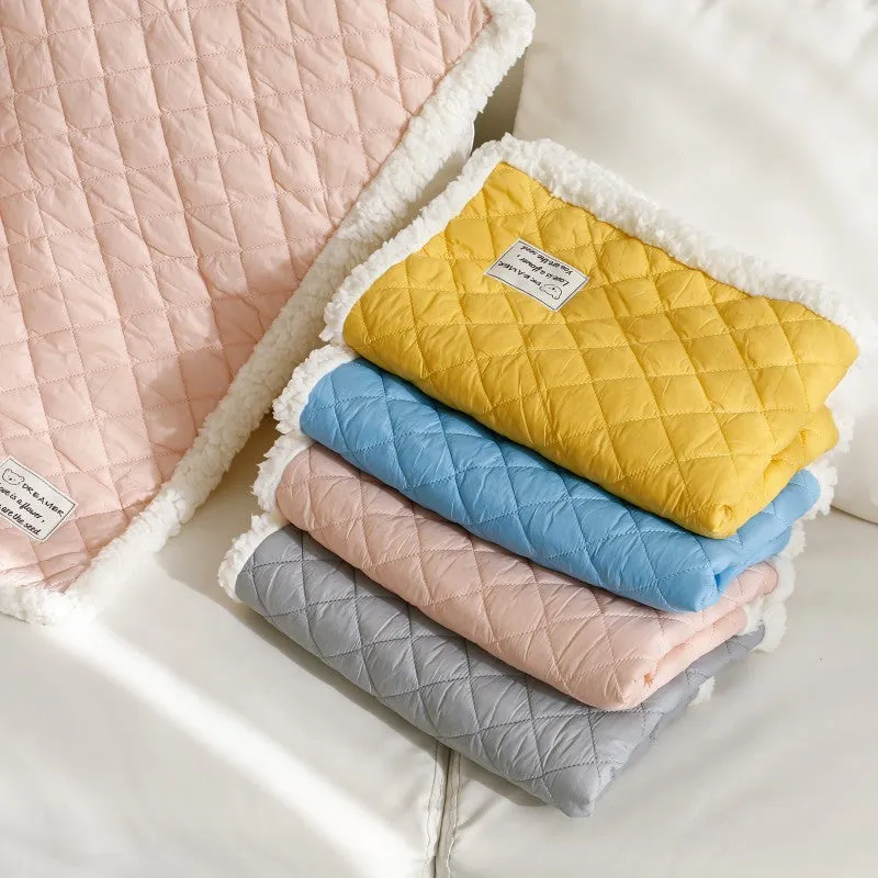 Soft blue terry cloth pet blanket for cats, shown on a pet bed, with size and colour options displayed.
