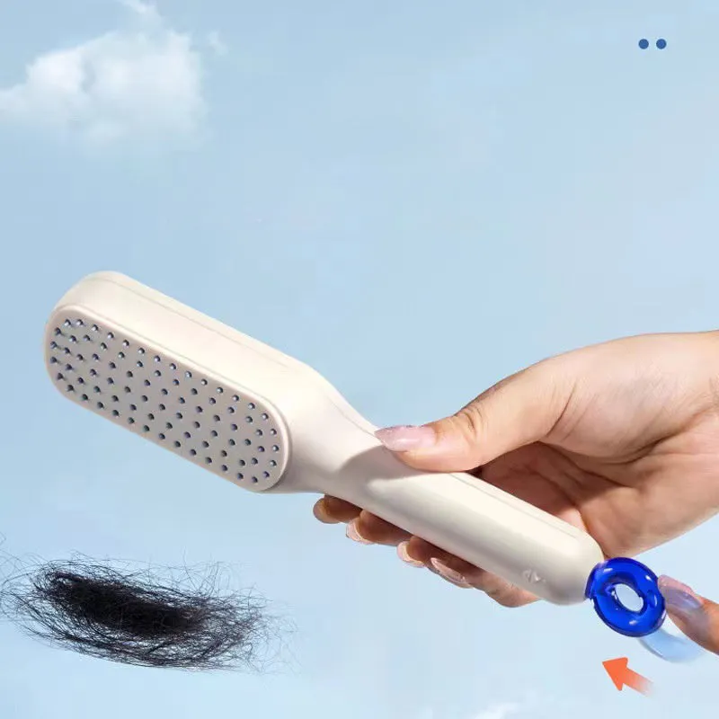 Blue, pink, and white dual-sided soft bristle brush for grooming small dogs