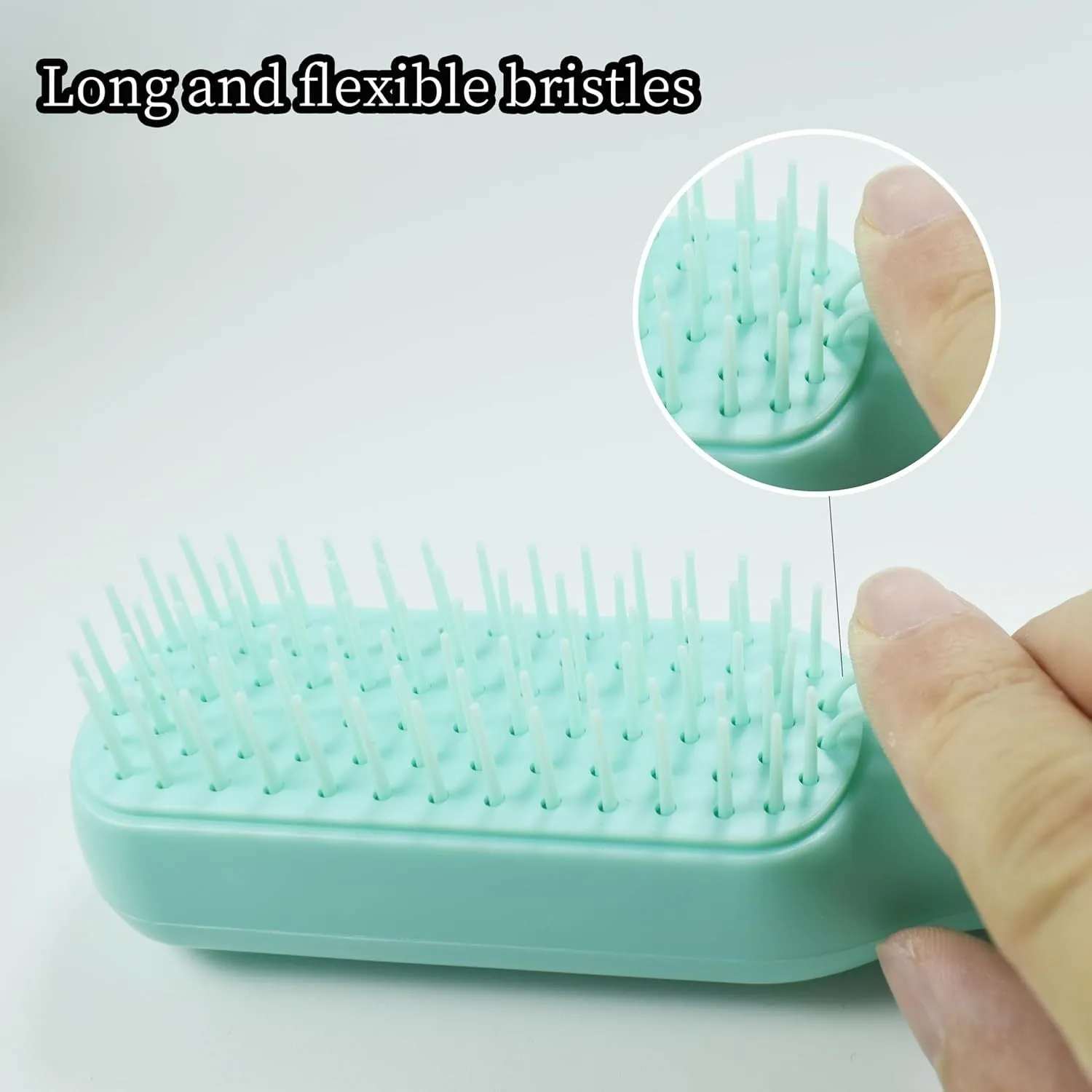 Blue, pink, and white dual-sided soft bristle brush for grooming small dogs