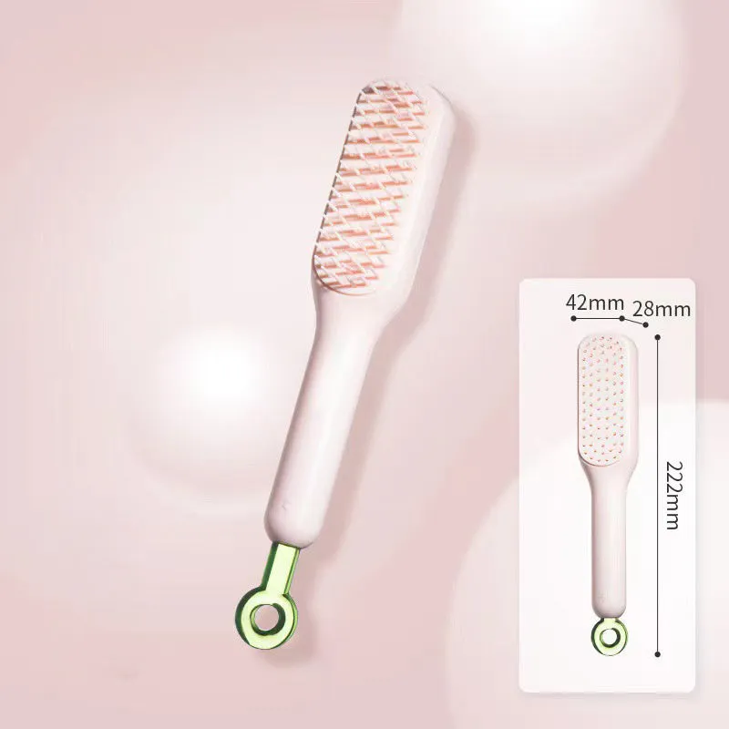 Blue, pink, and white dual-sided soft bristle brush for grooming small dogs