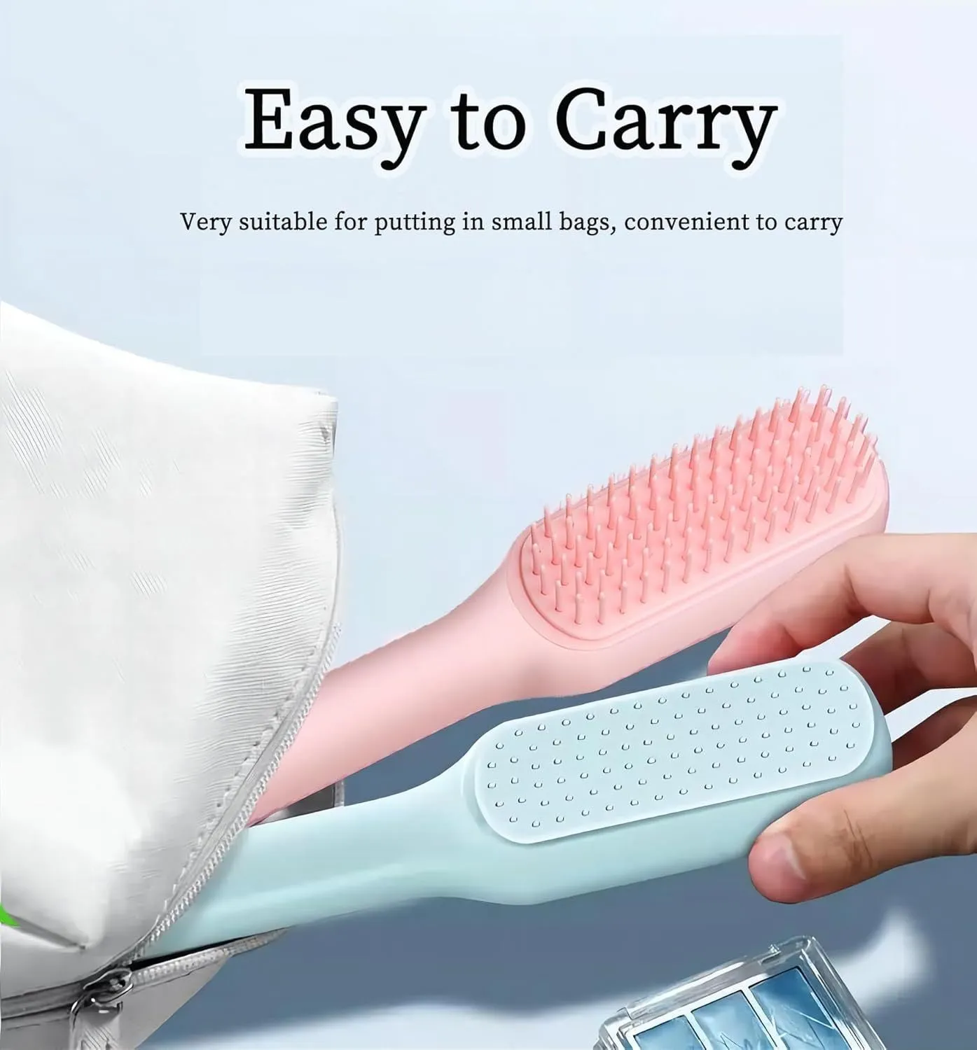 Blue, pink, and white dual-sided soft bristle brush for grooming small dogs