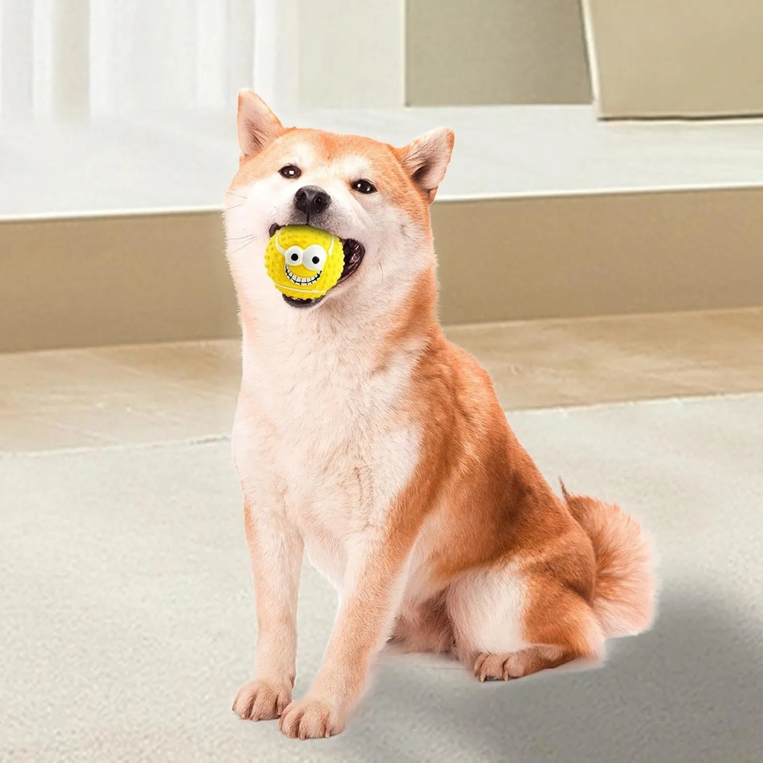 Green, orange, and yellow latex dog balls with smile faces, suitable for small to medium dogs