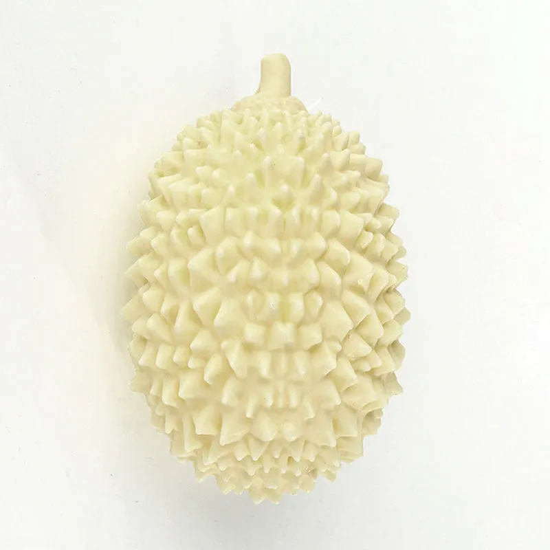 Durian-shaped dog chew toy in bright colours with teeth-cleaning ridges and squeaker ball