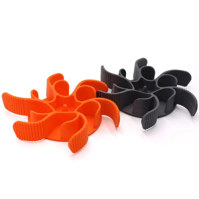 Red or grey silicone dog slow feeder insert with suction cups and conical handles on a white background.