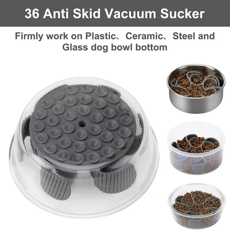 Red or grey silicone dog slow feeder insert with suction cups and conical handles on a white background.