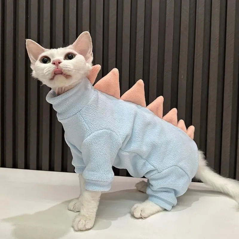Sphynx cat wearing dinosaur costume with tail and spikes