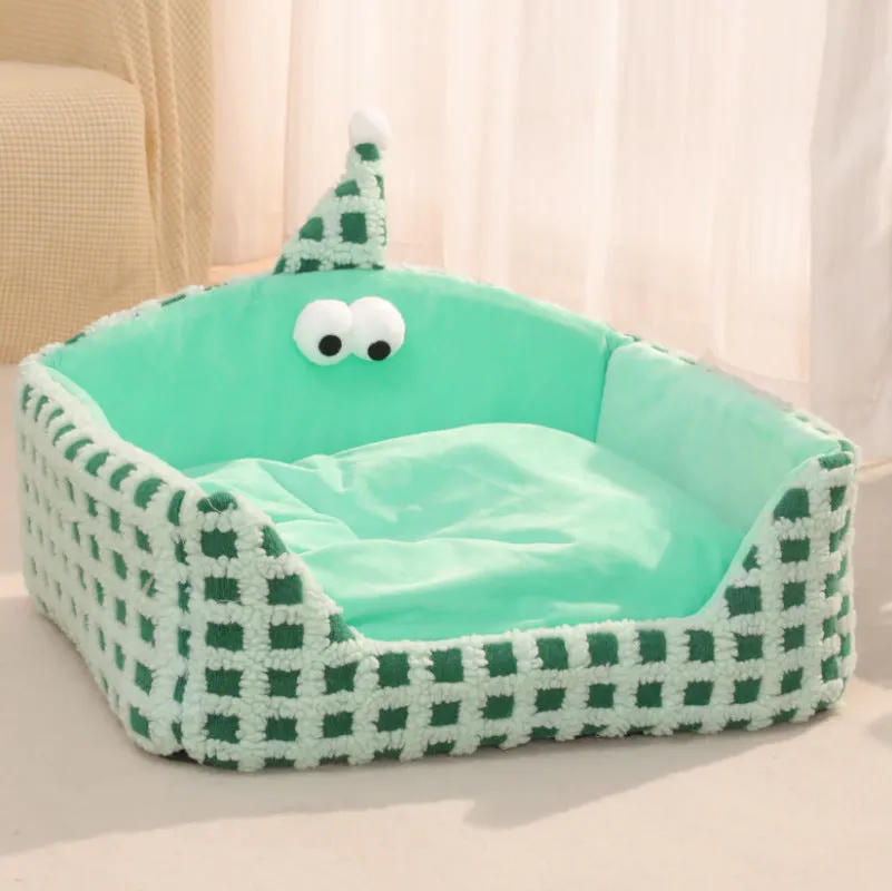 Green triangular hat-shaped pet sleeping nest for cats on a floor, showing its thick sponge construction.