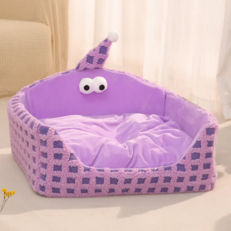 Green triangular hat-shaped pet sleeping nest for cats on a floor, showing its thick sponge construction.