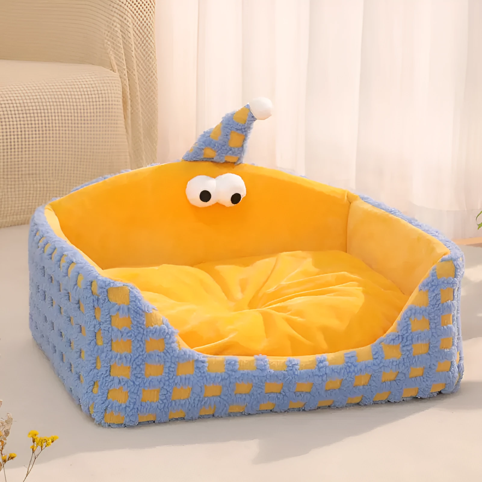 Green triangular hat-shaped pet sleeping nest for cats on a floor, showing its thick sponge construction.