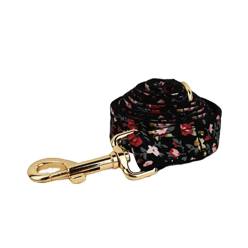 Dog wearing a cloth collar with removable bow, matching vest, and leash from the four-piece pet accessory set