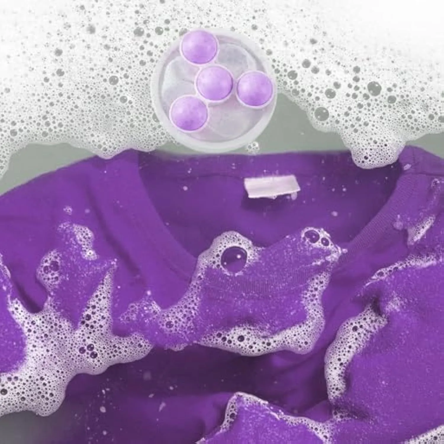 Three reusable washing machine hair filter bags in pink, blue and purple colours showing mesh construction