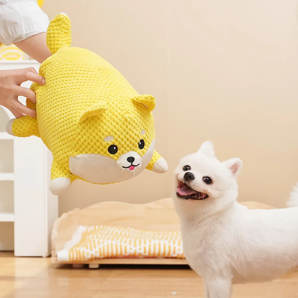 Plush calming dog toy shaped like a pillow, shown in a Large and Medium size.