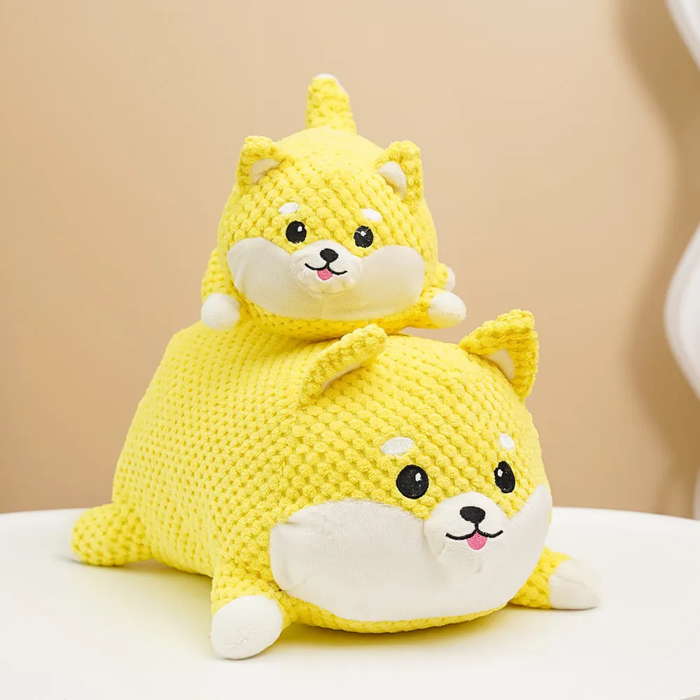Plush calming dog toy shaped like a pillow, shown in a Large and Medium size.