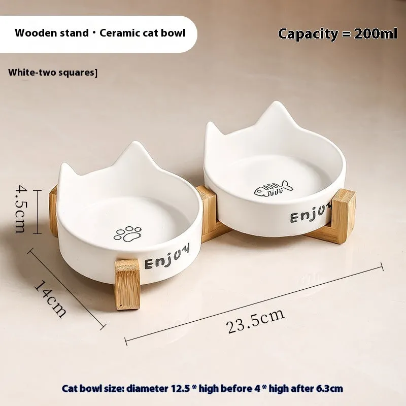 Porcelain cat food bowl with wooden anti-tumble frame in cat paw design