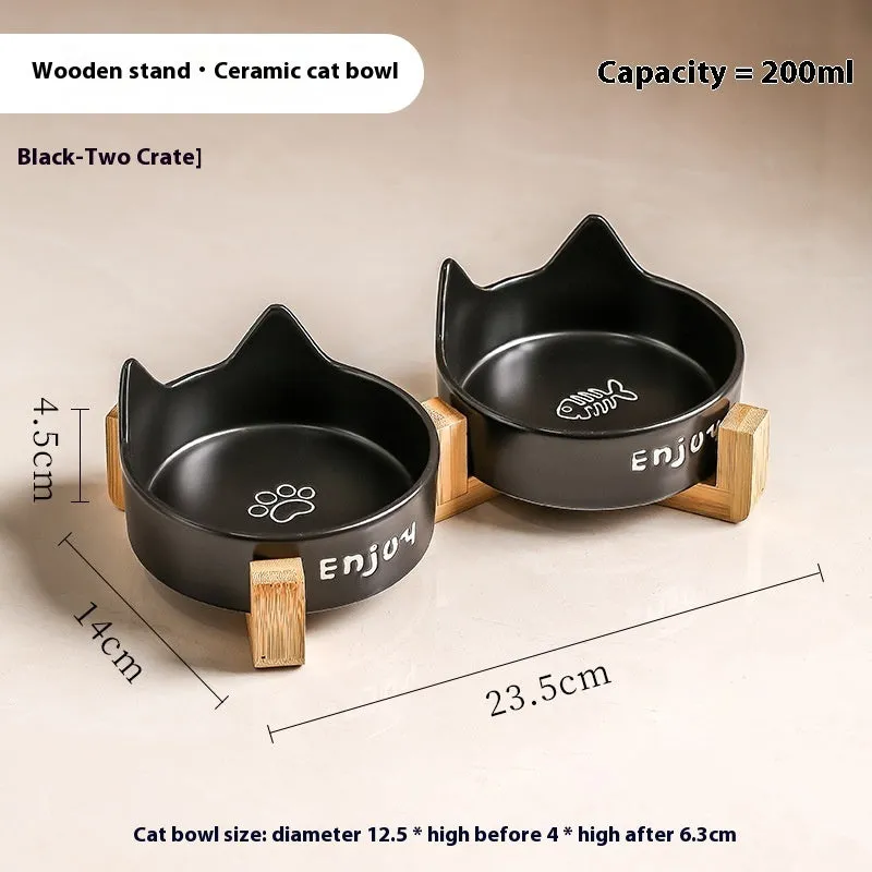 Porcelain cat food bowl with wooden anti-tumble frame in cat paw design
