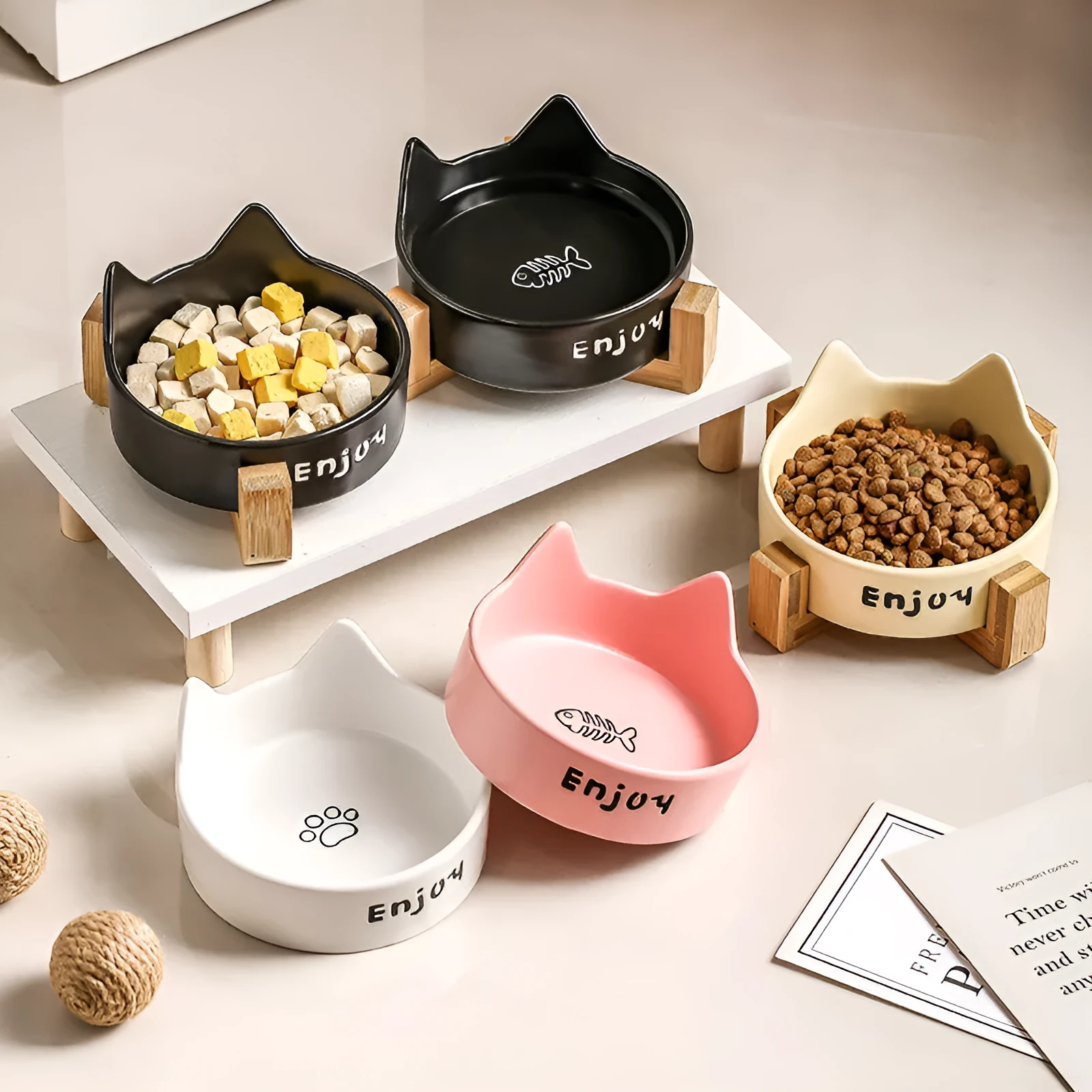 Porcelain cat food bowl with wooden anti-tumble frame in cat paw design