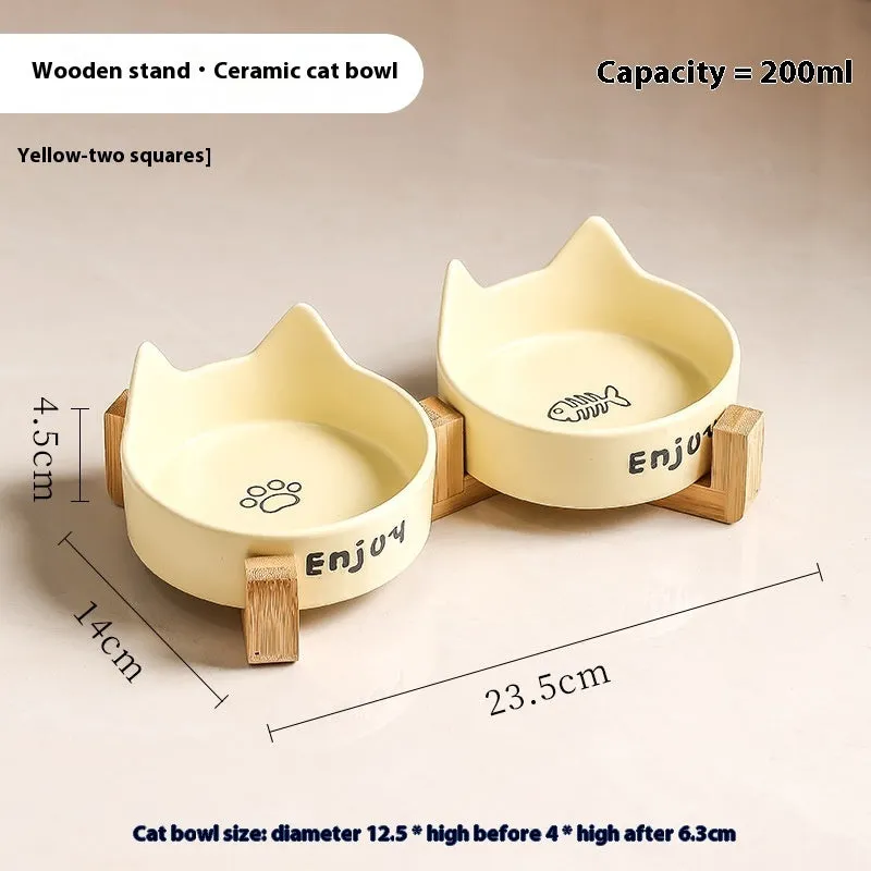 Porcelain cat food bowl with wooden anti-tumble frame in cat paw design