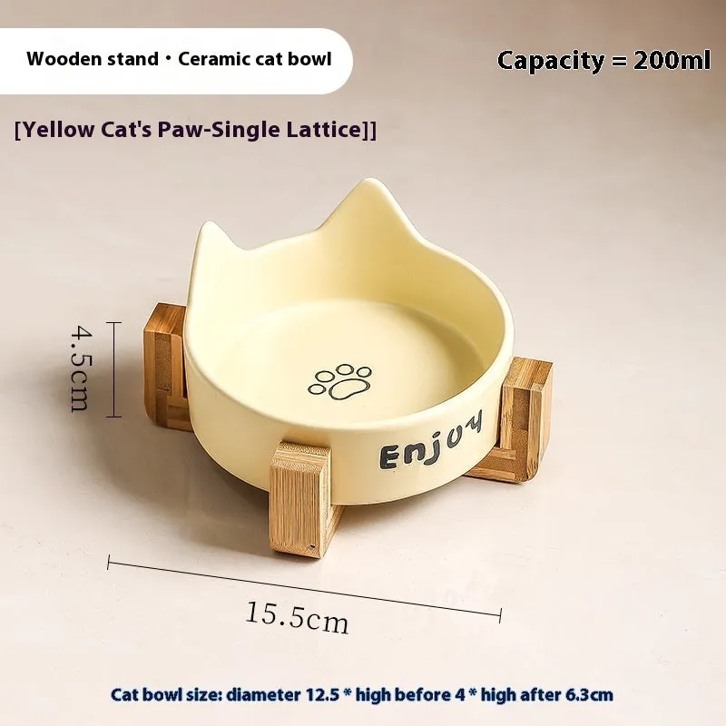 Porcelain cat food bowl with wooden anti-tumble frame in cat paw design