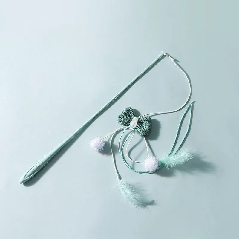 Blue cat teaser toy with a long pole, inflatable ego shape, and colourful feathers.