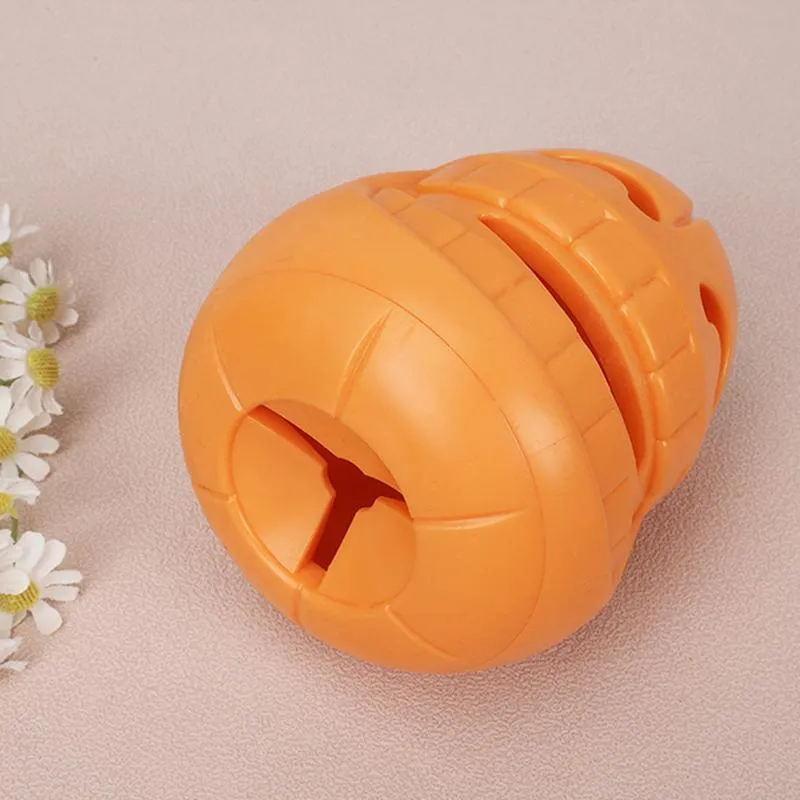 Yellow pumpkin-shaped TPR dog chew toy for aggressive chewers