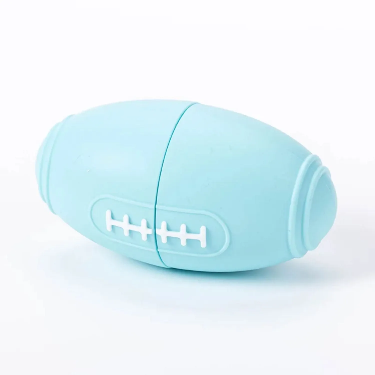 Coloured silicone rugby ball dog chew toy with treat-dispensing holes in blue, pink, purple options