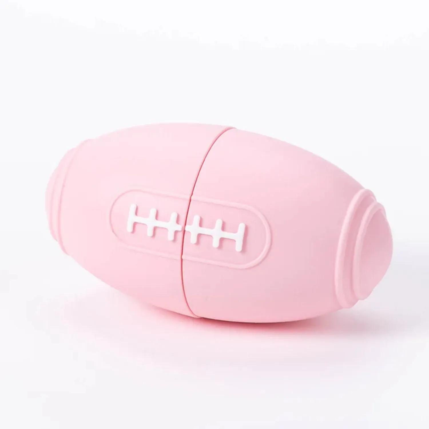 Coloured silicone rugby ball dog chew toy with treat-dispensing holes in blue, pink, purple options