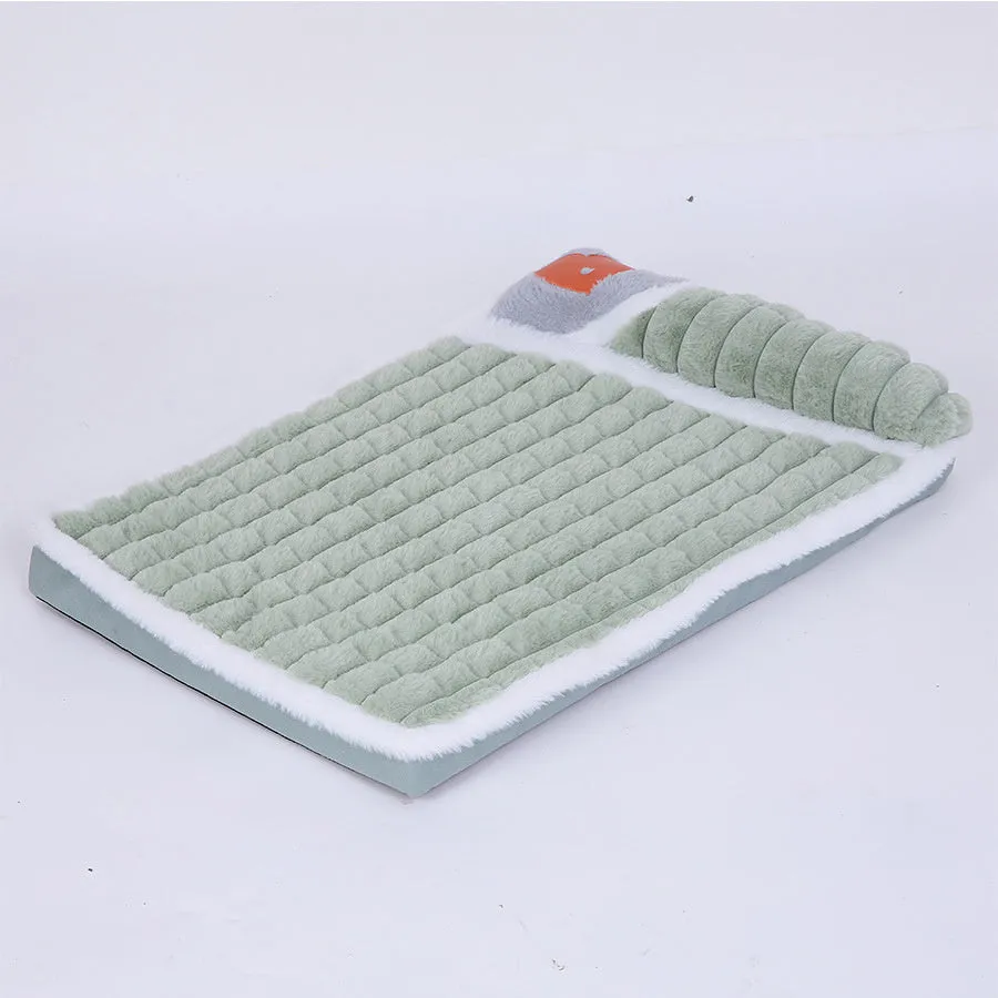 Large rectangular dog bed mat with a removable cover in a grey colour on a wooden floor.