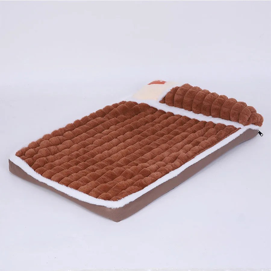 Large rectangular dog bed mat with a removable cover in a grey colour on a wooden floor.