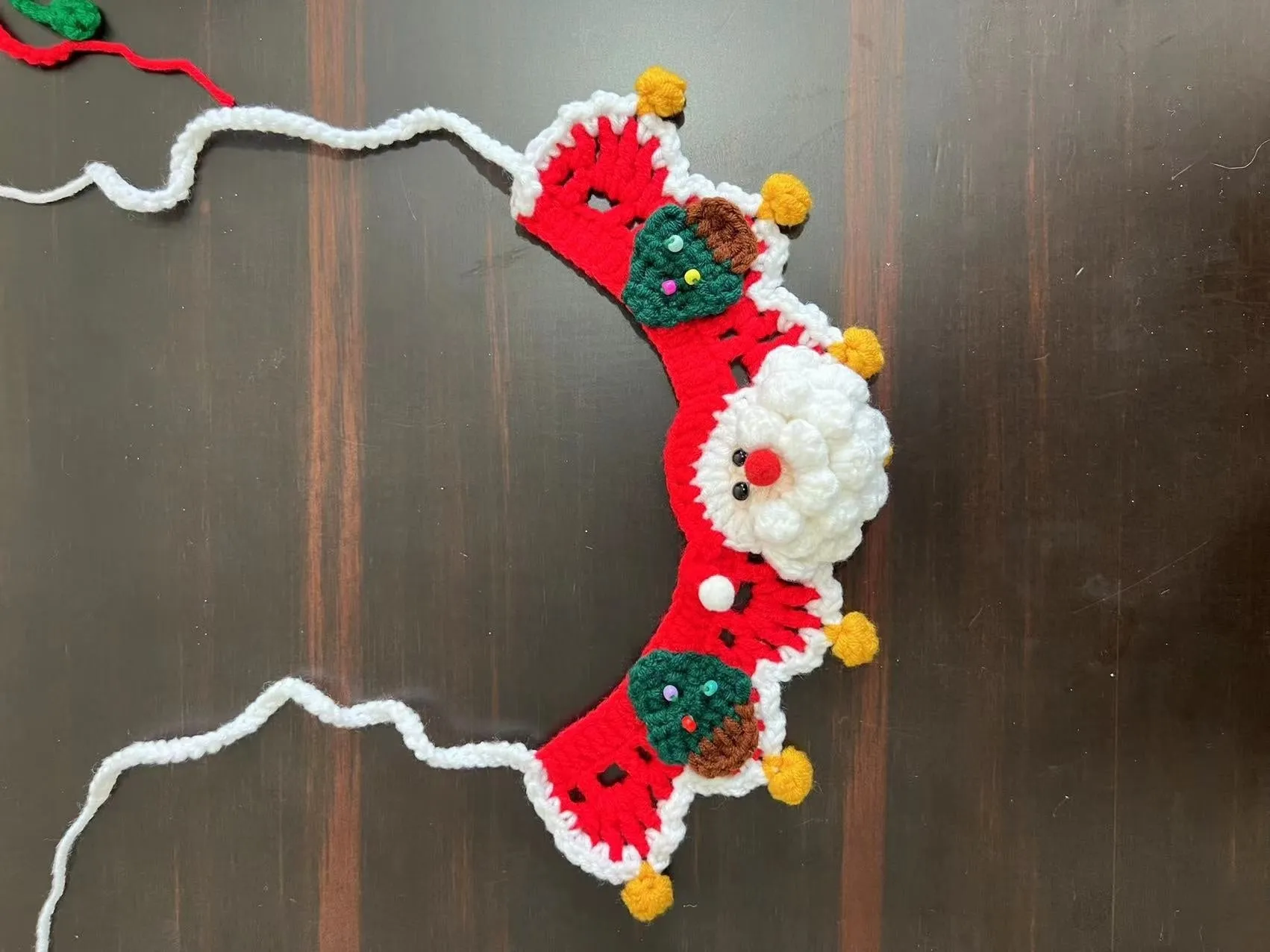 Knitted wool pet scarf with Christmas designs including striped Santa Claus pattern
