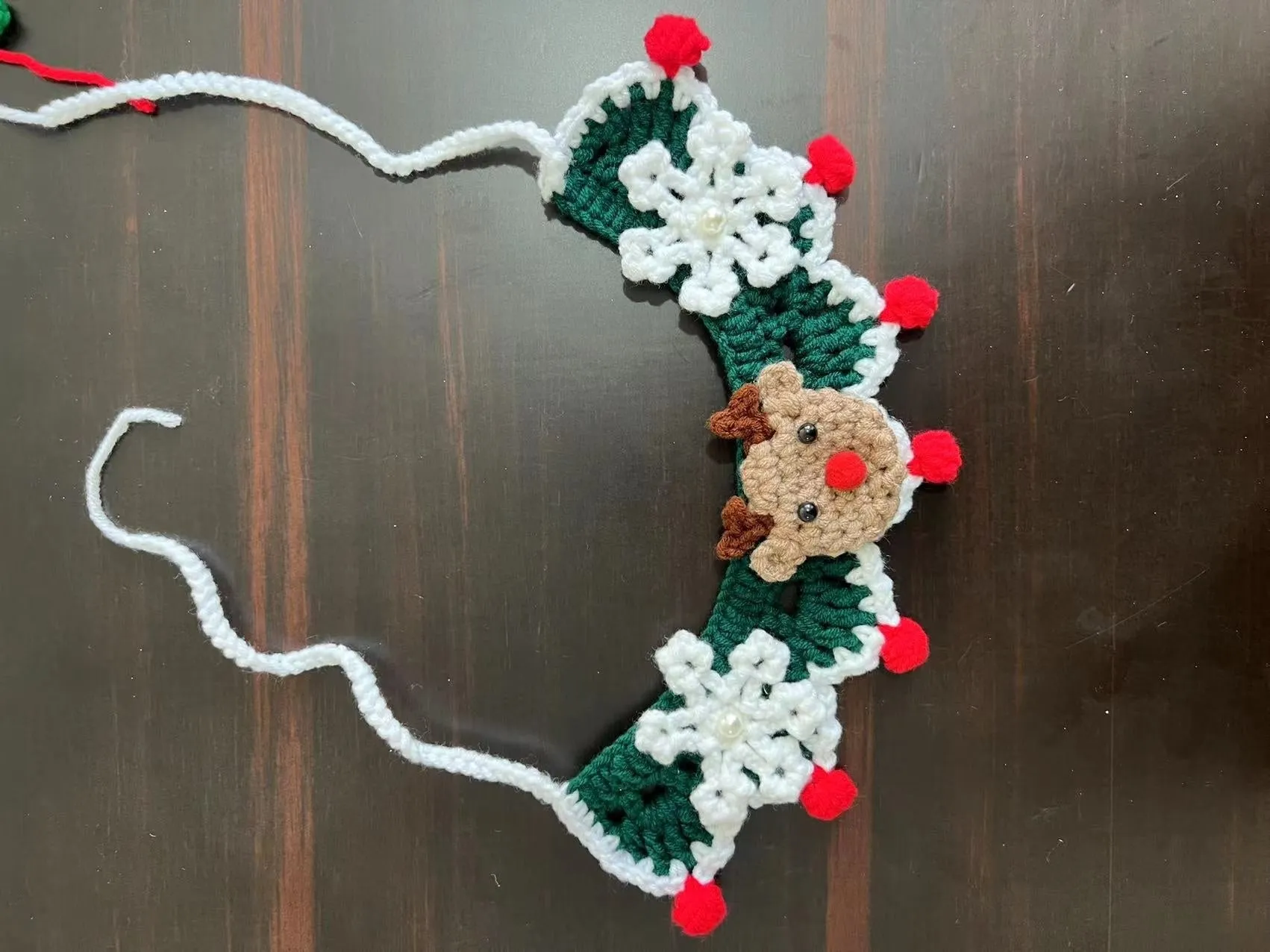 Knitted wool pet scarf with Christmas designs including striped Santa Claus pattern
