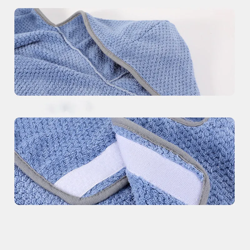 Blue dog bath robe with adjustable waistband fastened on a dog, showing absorbent fabric and sizing for drying.