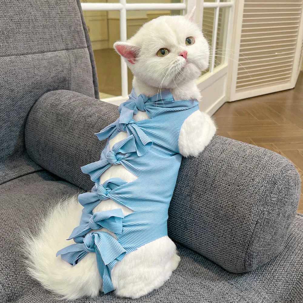 Lace-up polyester cat sterilisation clothing shown in blue on a mannequin, sizes for cats 1.5kg to 9kg.