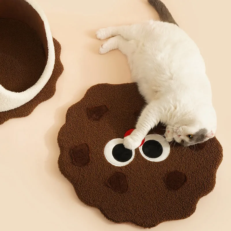 Khaki-coloured closed cat house with a nest shape resembling a sandwich cookie.