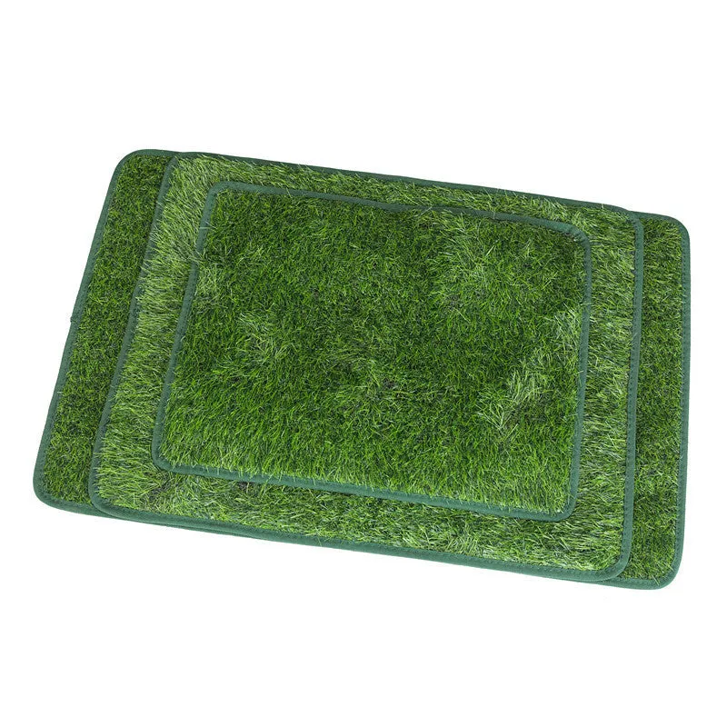 Green washable dog grass pee pad with realistic lawn texture on a patio.