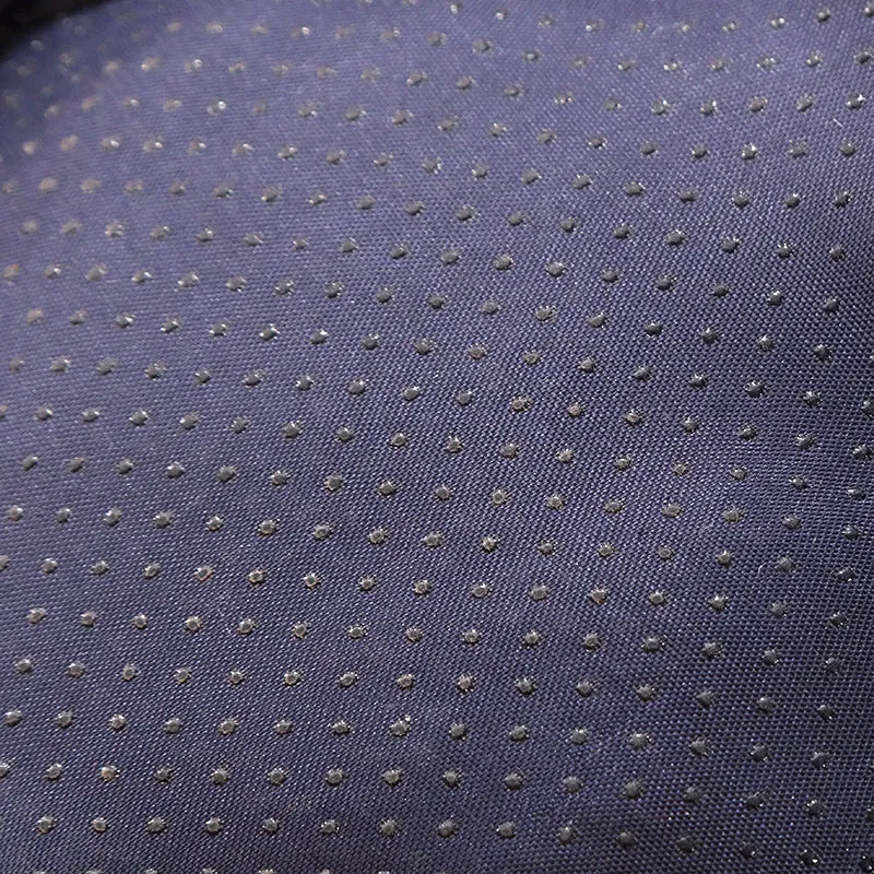 Blue enclosed cat bed with removable fleece liner, shown in a home setting.