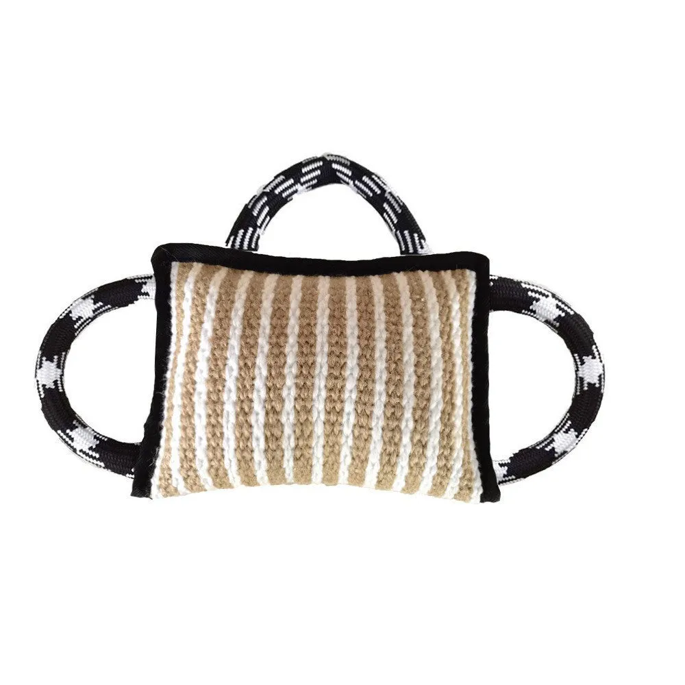Colourful dog tug toy with a jute bite pillow centre and three rope handles.